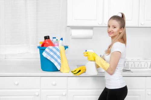 Cleaner preparing carpet cleaning equipment safely before a job