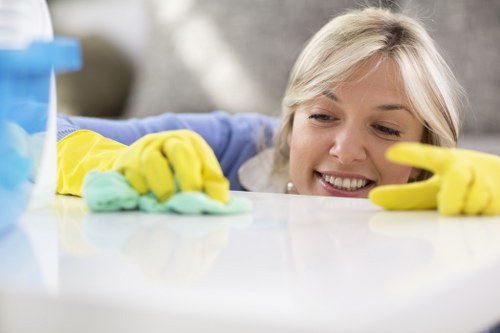 Operative using carpet cleaning machine with safety precautions