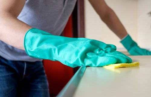 Cleaners removing construction dust from windows and fixtures in Chiswick
